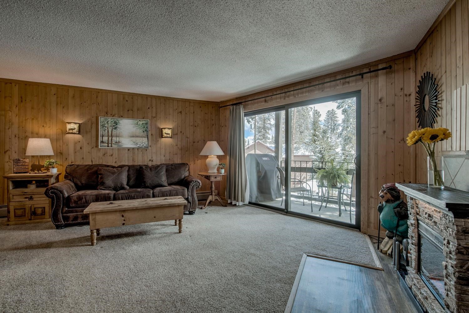 1075 Ski Hill Road, Unit 46 Breckenridge, CO 80424 - Photo 6 of 41 a living room with furniture and a flat screen tv