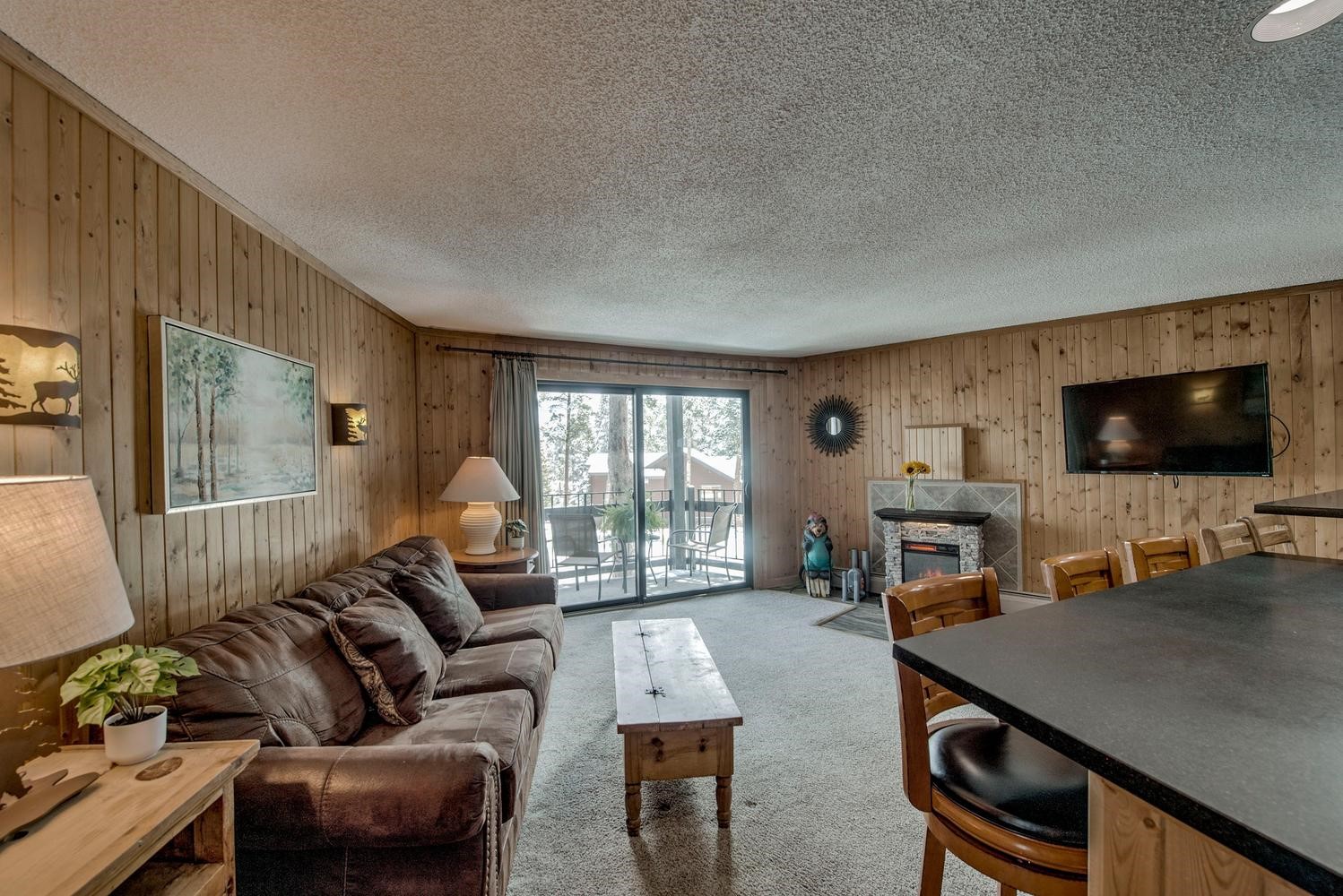 1075 Ski Hill Road, Unit 46 Breckenridge, CO 80424 - Photo 7 of 41 a living room with furniture and a flat screen tv