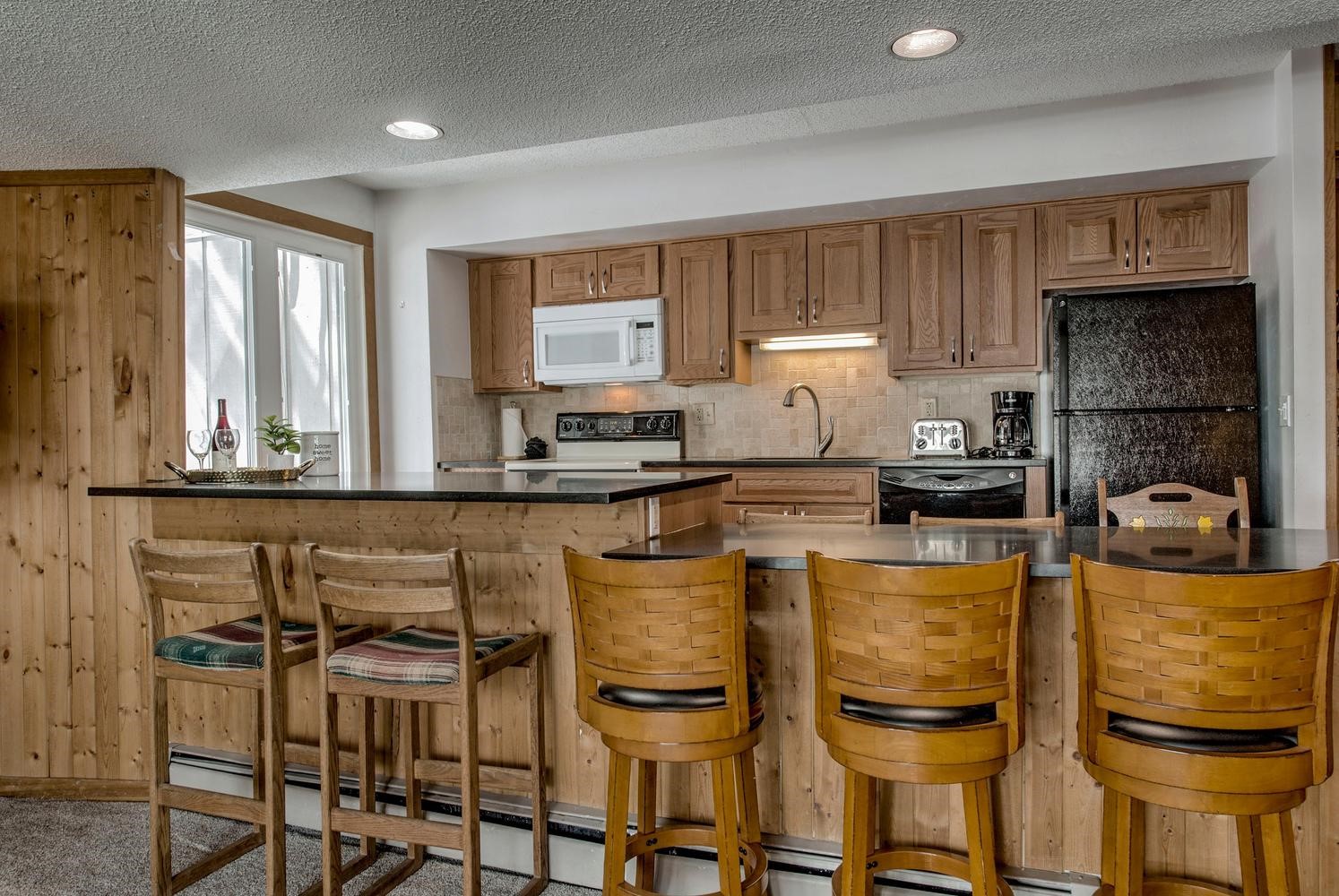 1075 Ski Hill Road, Unit 46 Breckenridge, CO 80424 - Photo 10 of 41 a kitchen with a sink cabinets and window