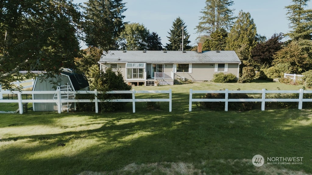 310 G Street Forks, WA 98331 - Photo 1 of 40 a view of a house with a backyard