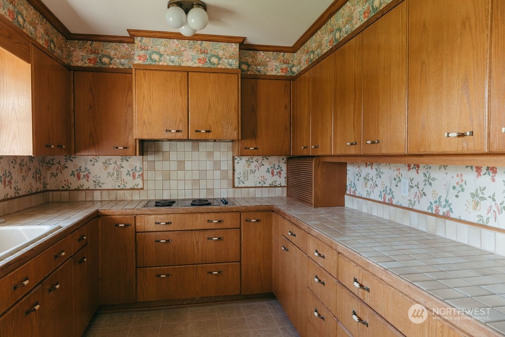 310 G Street Forks, WA 98331 - Photo 15 of 40 a kitchen with a sink and cabinets