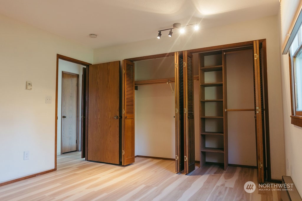 310 G Street Forks, WA 98331 - Photo 16 of 40 wooden floor and windows in a room
