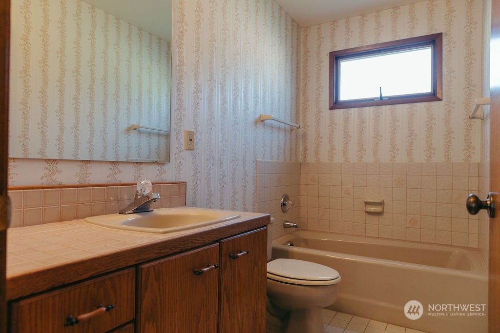 310 G Street Forks, WA 98331 - Photo 19 of 40 a bathroom with a sink a toilet and shower