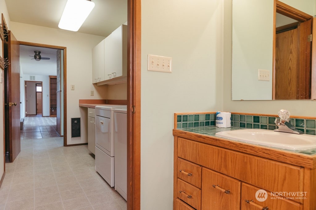 310 G Street Forks, WA 98331 - Photo 21 of 40 a bathroom with a sink and a mirror