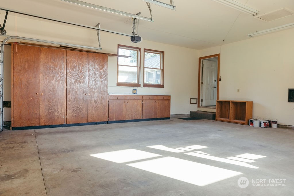 310 G Street Forks, WA 98331 - Photo 26 of 40 a view of an empty room with a fireplace and a window