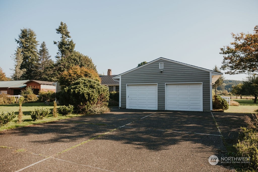 310 G Street Forks, WA 98331 - Photo 4 of 40 a front view of a house with a yard