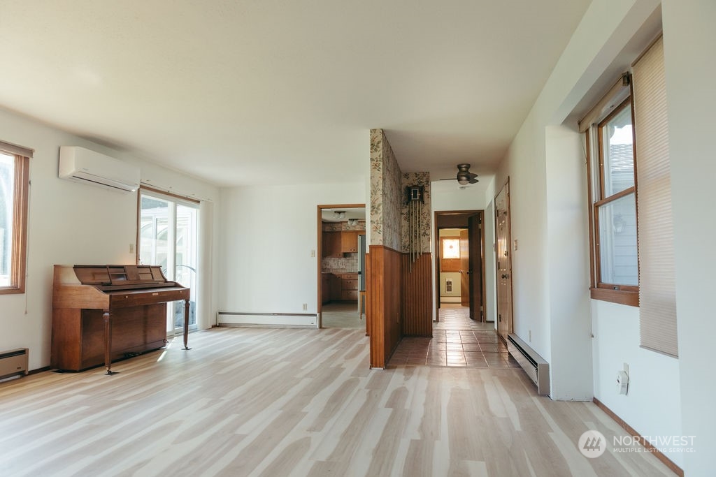310 G Street Forks, WA 98331 - Photo 10 of 40 a view of a hallway view with wooden floor and furniture