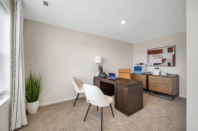 a kitchen with a table and chairs in it