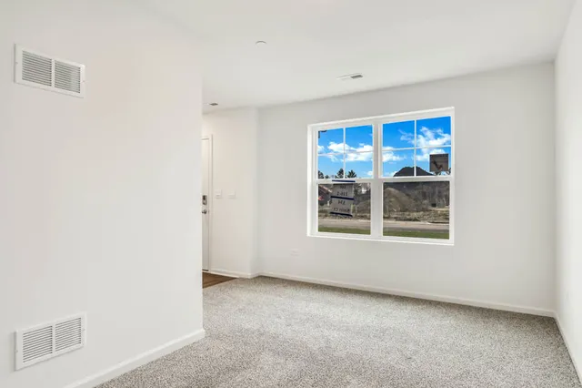 a view of a big room with a window