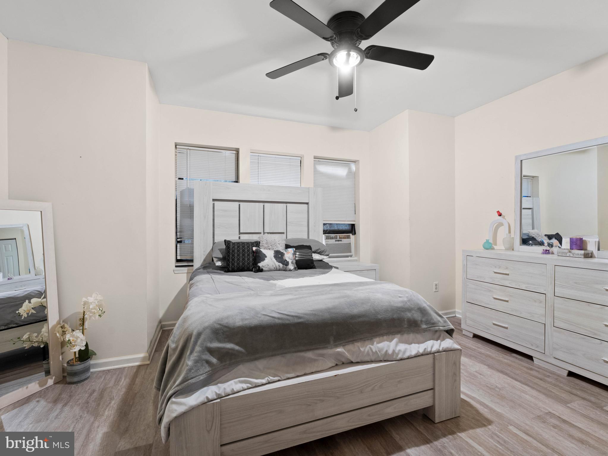 3014 Stevens Street Camden, NJ 08105 - Photo 13 of 34 a bedroom with a bed and a chandelier