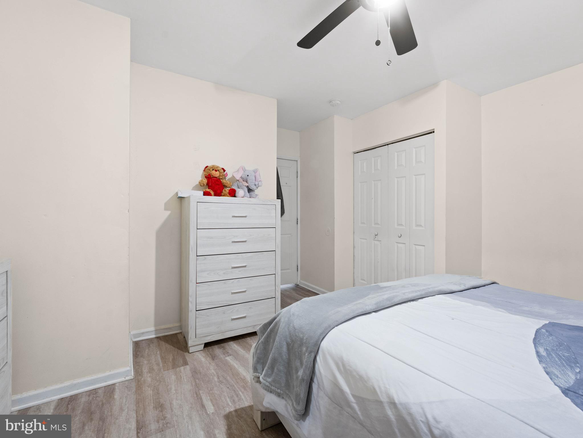 3014 Stevens Street Camden, NJ 08105 - Photo 14 of 34 a bedroom with a bed and a dresser