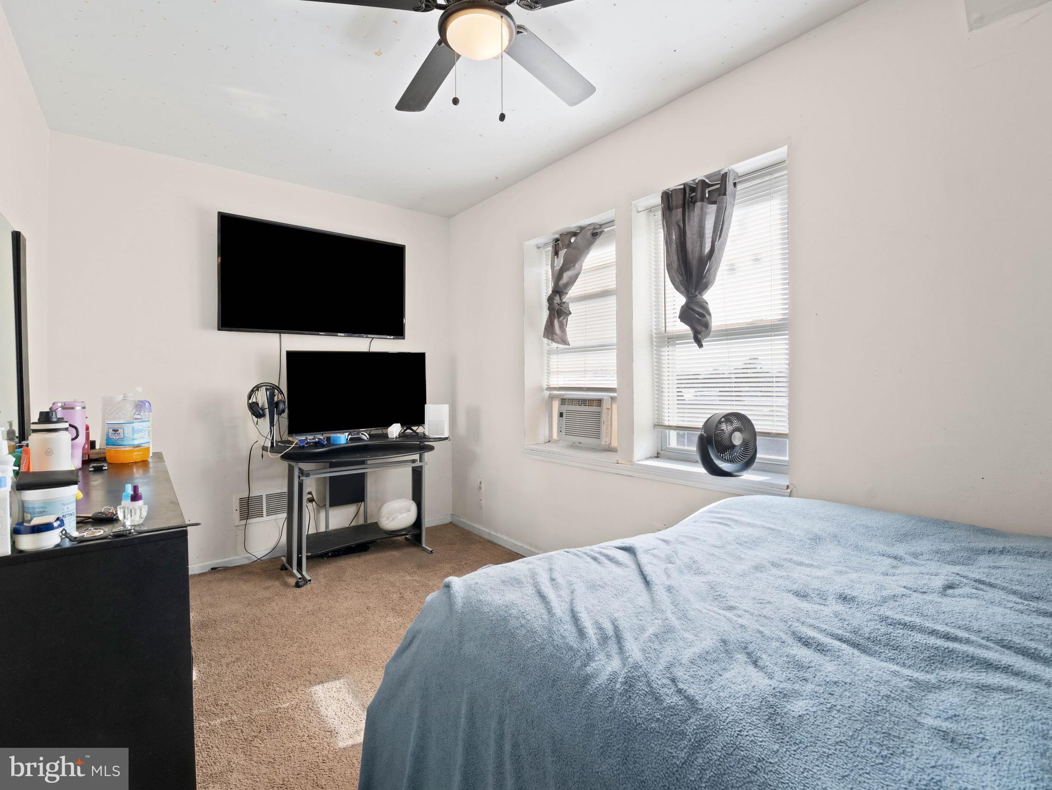 3014 Stevens Street Camden, NJ 08105 - Photo 15 of 34 a bedroom with a bed and a flat screen tv