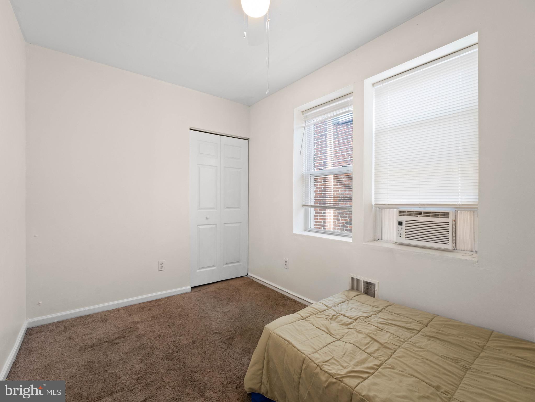 3014 Stevens Street Camden, NJ 08105 - Photo 17 of 34 a bedroom with a bed and a window
