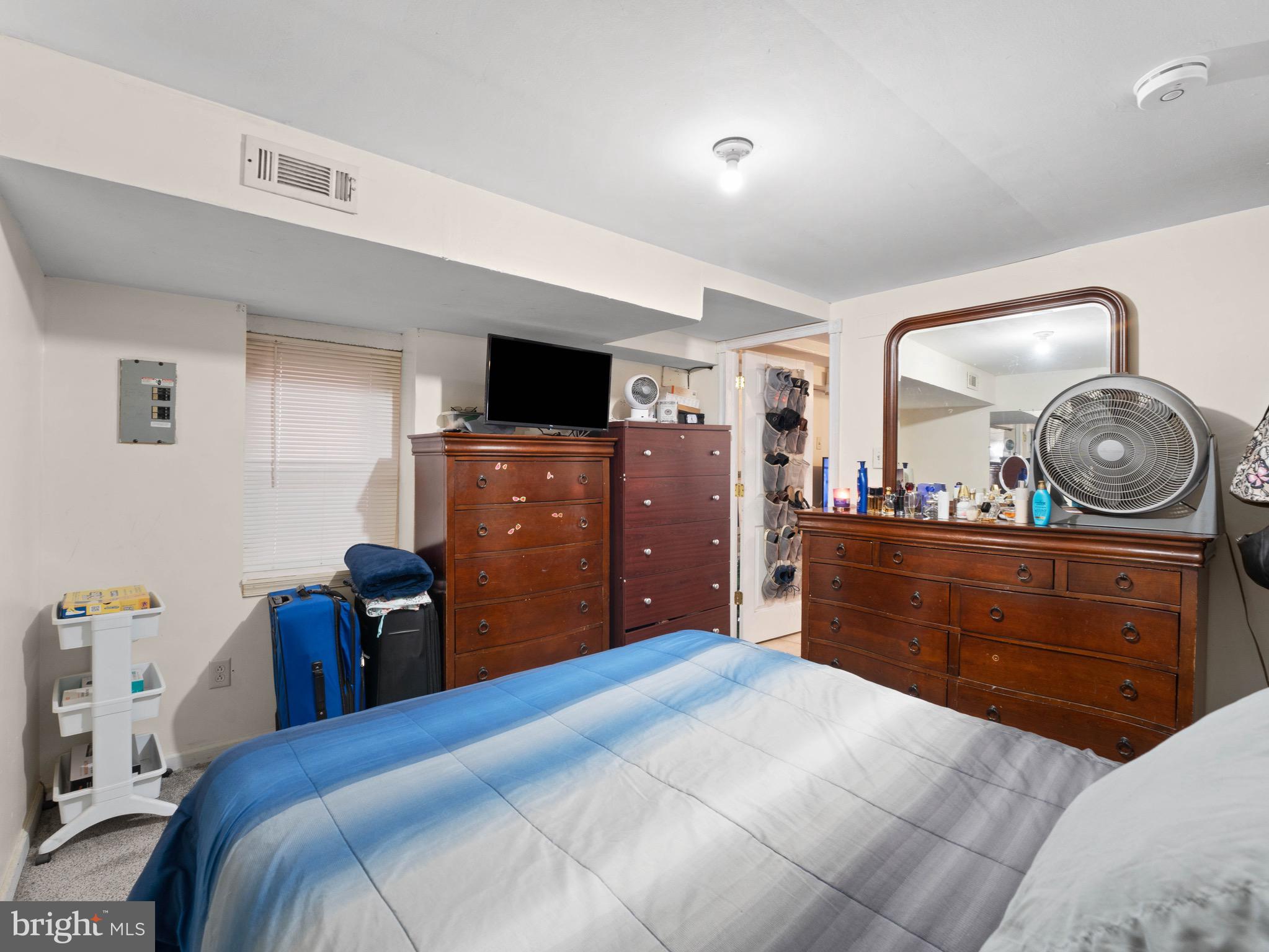 3014 Stevens Street Camden, NJ 08105 - Photo 27 of 34 a bedroom with a bed and a dresser