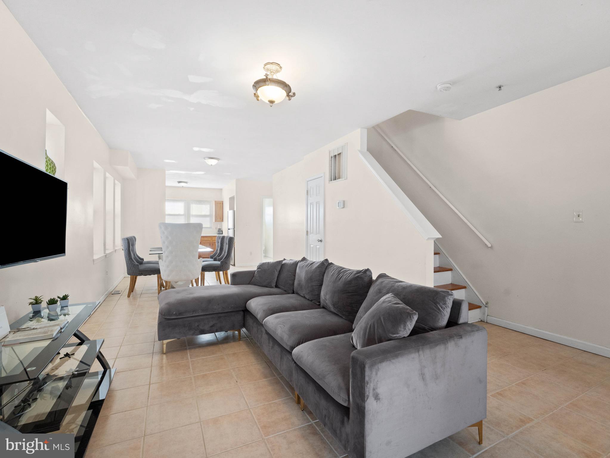 3014 Stevens Street Camden, NJ 08105 - Photo 3 of 34 a living room with furniture and a flat screen tv