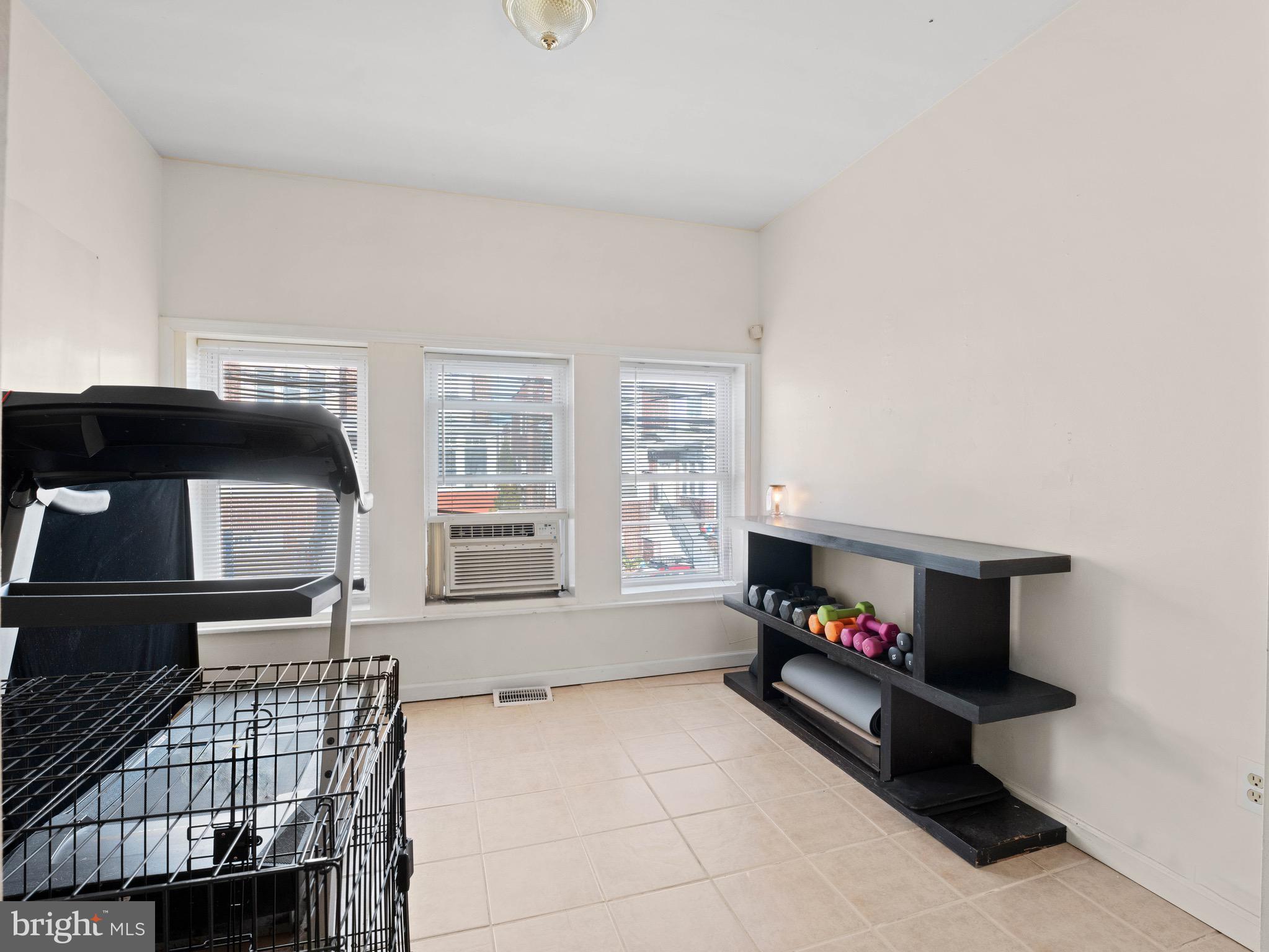 3014 Stevens Street Camden, NJ 08105 - Photo 5 of 34 a living room with furniture and a flat screen tv