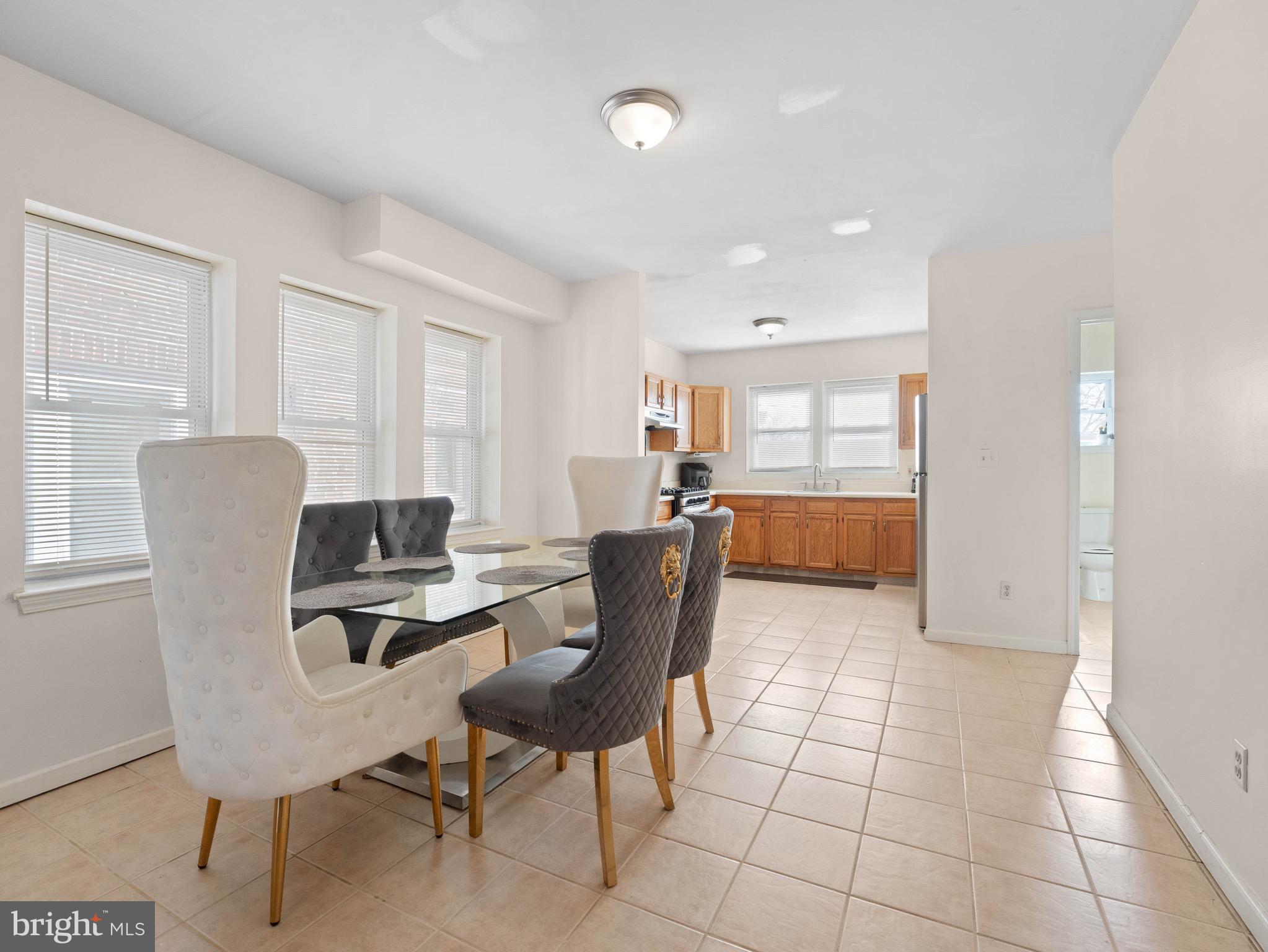 3014 Stevens Street Camden, NJ 08105 - Photo 7 of 34 a living room with furniture a dining table and a window