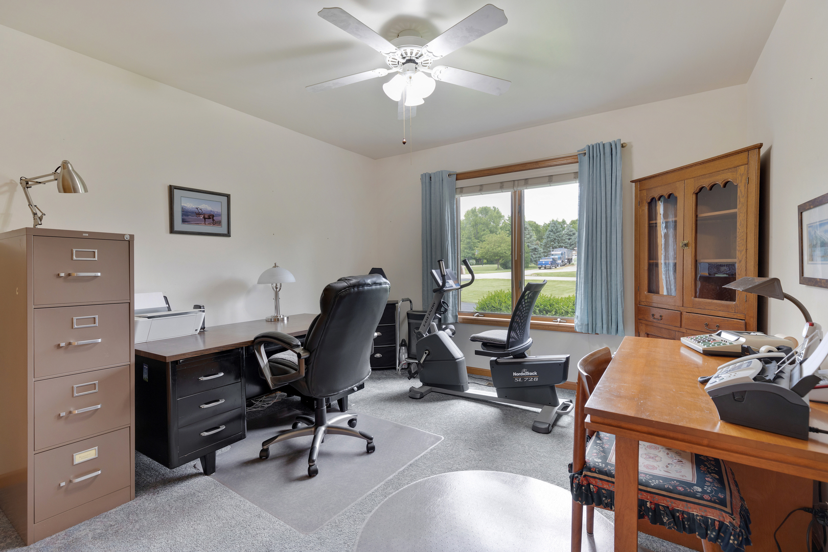 12402 Ridge Road Genoa, IL 60135 - Photo 18 of 31 a view of a workspace with furniture and a window