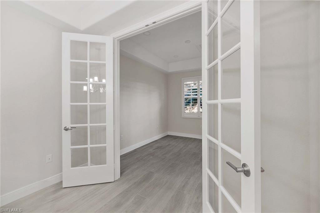 6438 Legacy Circle, Unit 301 Naples, FL 34113 - Photo 17 of 46 an empty room with windows