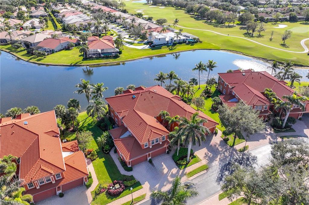 6438 Legacy Circle, Unit 301 Naples, FL 34113 - Photo 3 of 46 an aerial view of a house with a swimming pool yard and outdoor seating