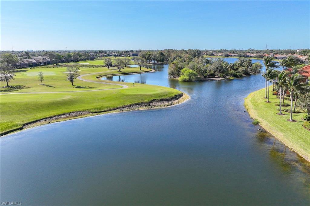 6438 Legacy Circle, Unit 301 Naples, FL 34113 - Photo 33 of 46 a view of a swimming pool with an ocean view