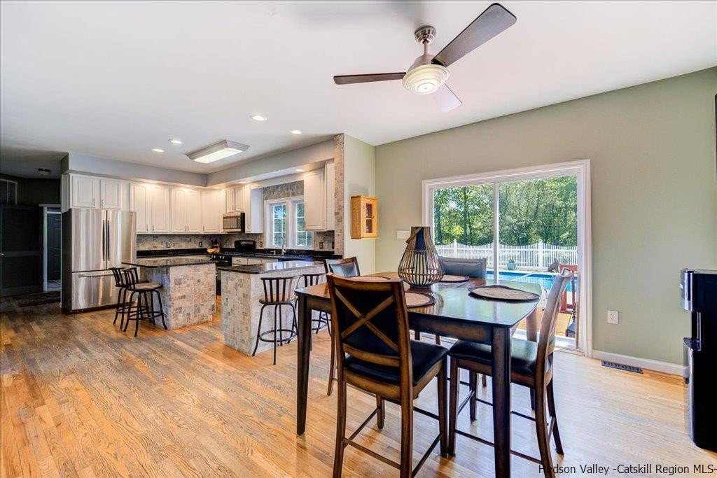 1237 Hoagerburgh Road Wallkill, NY 12589 - Photo 12 of 35 a view of a dining room with furniture window and wooden floor