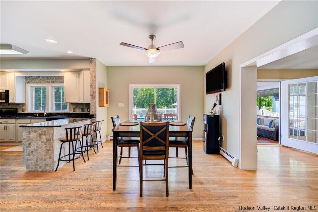 1237 Hoagerburgh Road Wallkill, NY 12589 - Photo 18 of 35 a view of a a dining room with furniture window and wooden floor
