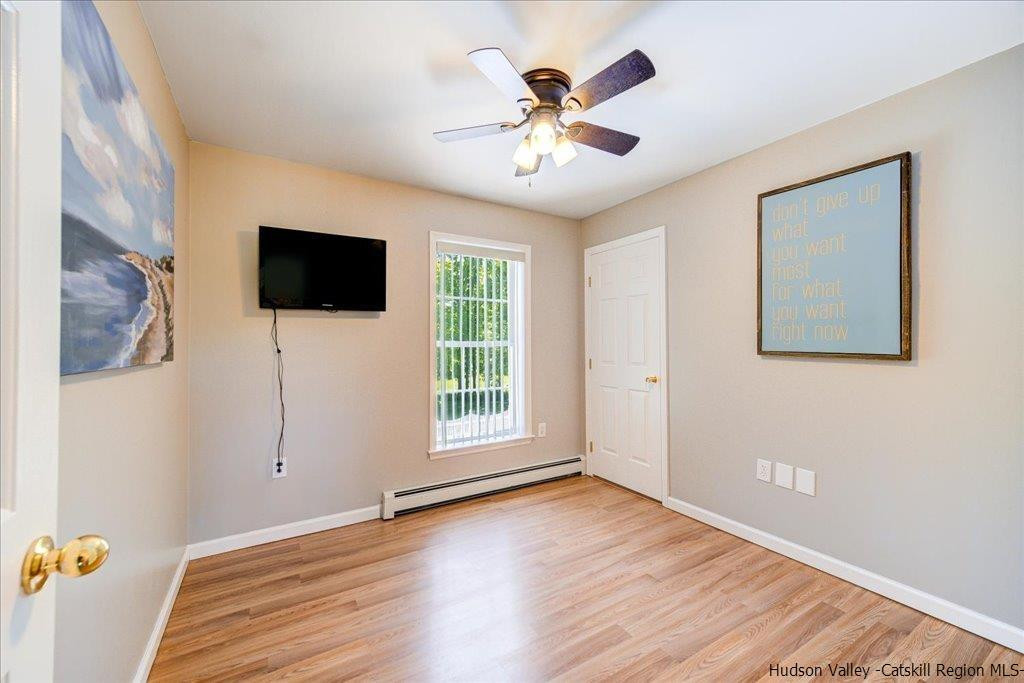 1237 Hoagerburgh Road Wallkill, NY 12589 - Photo 21 of 35 a view of livingroom with hardwood floor and ceiling fan