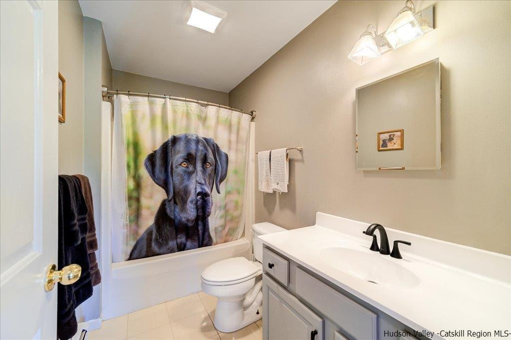 1237 Hoagerburgh Road Wallkill, NY 12589 - Photo 24 of 35 a bathroom with a toilet sink and mirror