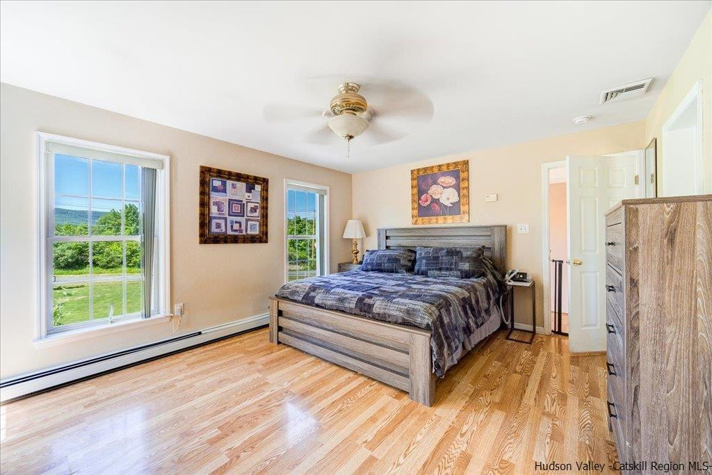 1237 Hoagerburgh Road Wallkill, NY 12589 - Photo 26 of 35 a spacious bedroom with a bed and a window