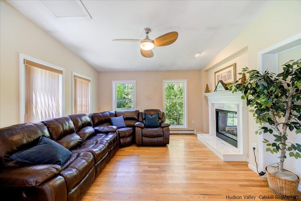 1237 Hoagerburgh Road Wallkill, NY 12589 - Photo 7 of 35 a living room with furniture fireplace and window