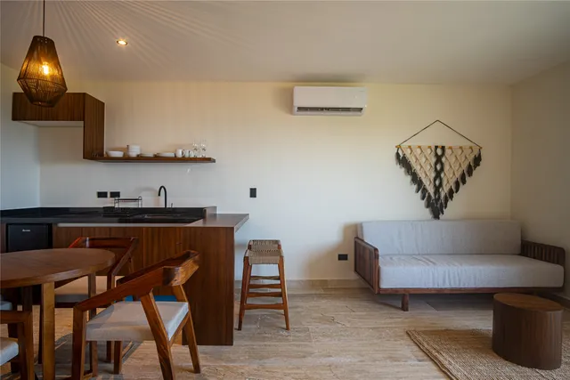 a living room with furniture and a lamp