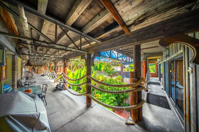 a view of a yard with wooden fence