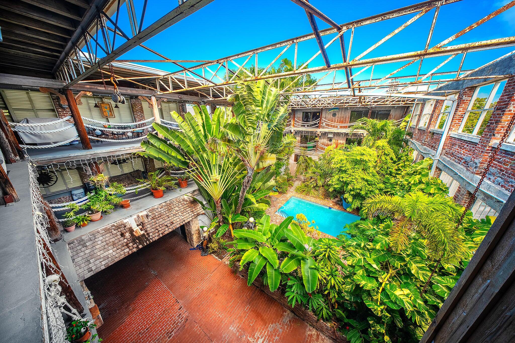 314 Simonton Street Key West, FL 33040 - Photo 17 of 32 a view of a yard with wooden fence