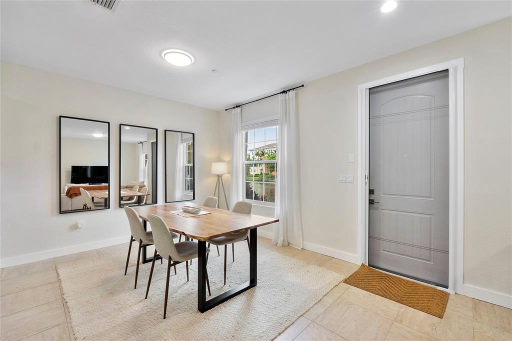 163 Southwest 7th Street Pompano Beach, FL 33060 - Photo 12 of 54 a view of a livingroom with furniture and window