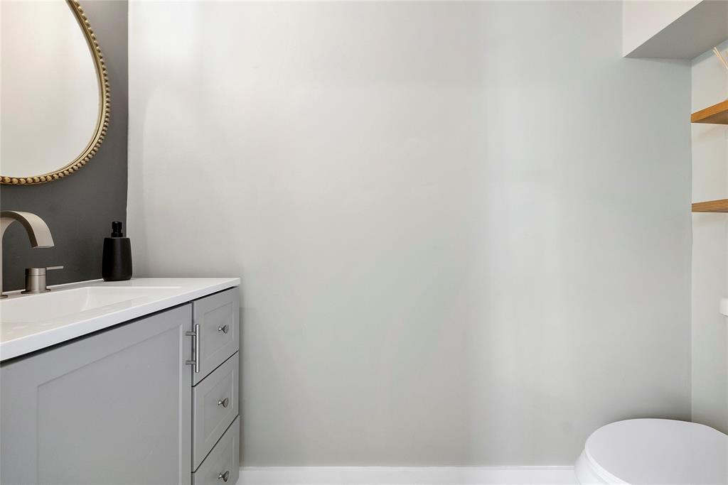 163 Southwest 7th Street Pompano Beach, FL 33060 - Photo 19 of 54 a bathroom with a sink and a toilet