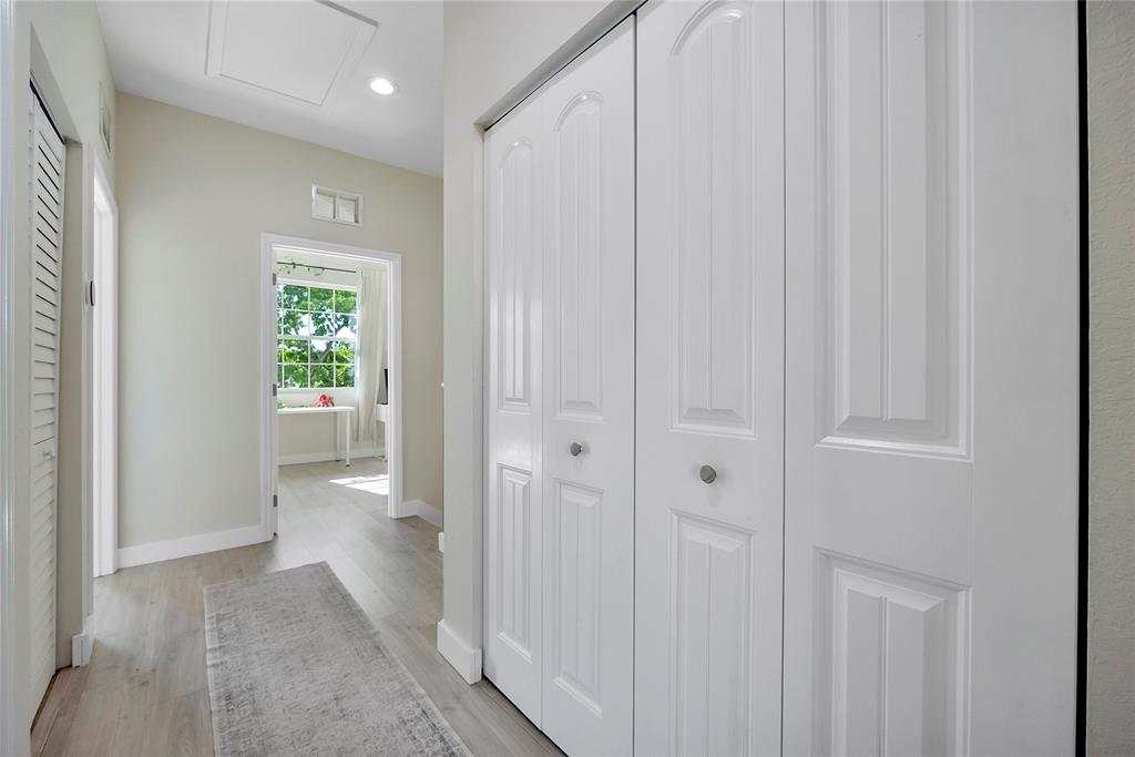 163 Southwest 7th Street Pompano Beach, FL 33060 - Photo 23 of 54 a view of a hallway with wooden shelves