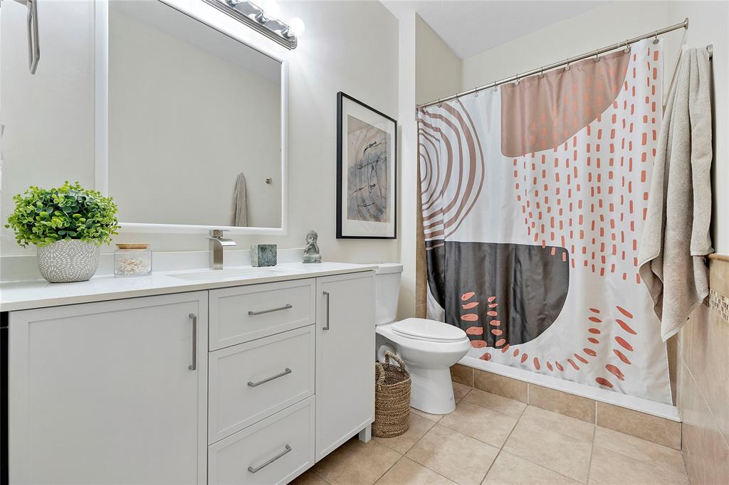 163 Southwest 7th Street Pompano Beach, FL 33060 - Photo 25 of 54 a bathroom with a sink toilet and shower