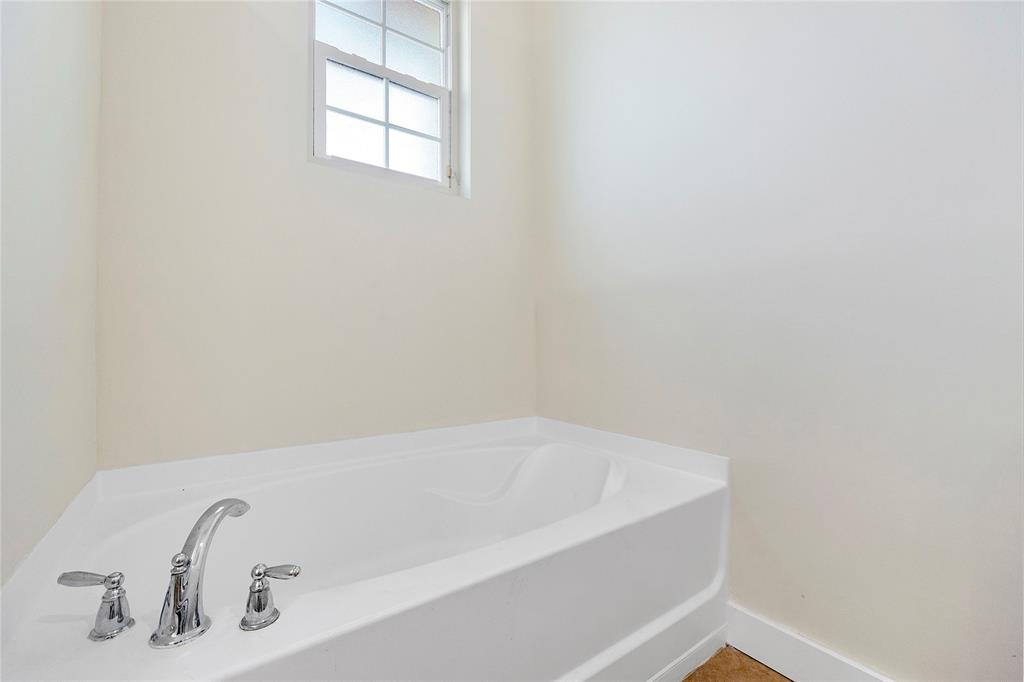 163 Southwest 7th Street Pompano Beach, FL 33060 - Photo 29 of 54 a bathroom with a bathtub