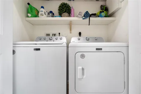 a view of backyard with swimming pool and outdoor seating