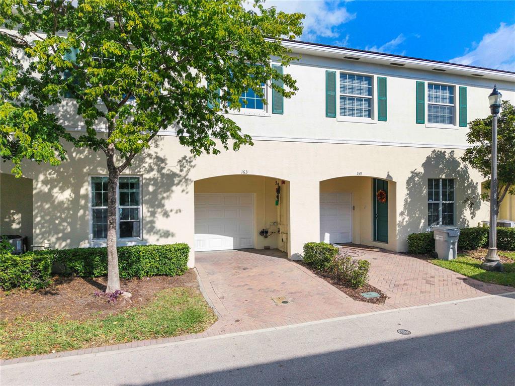 163 Southwest 7th Street Pompano Beach, FL 33060 - Photo 35 of 54 front view of a house with a yard