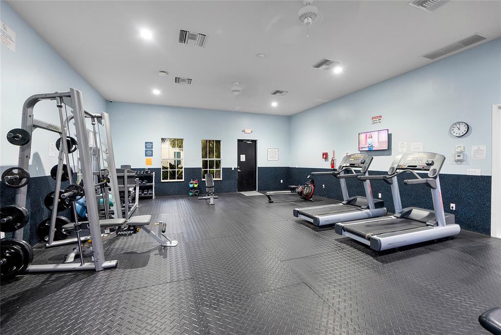 163 Southwest 7th Street Pompano Beach, FL 33060 - Photo 36 of 54 a living room with lots of furniture and white walls