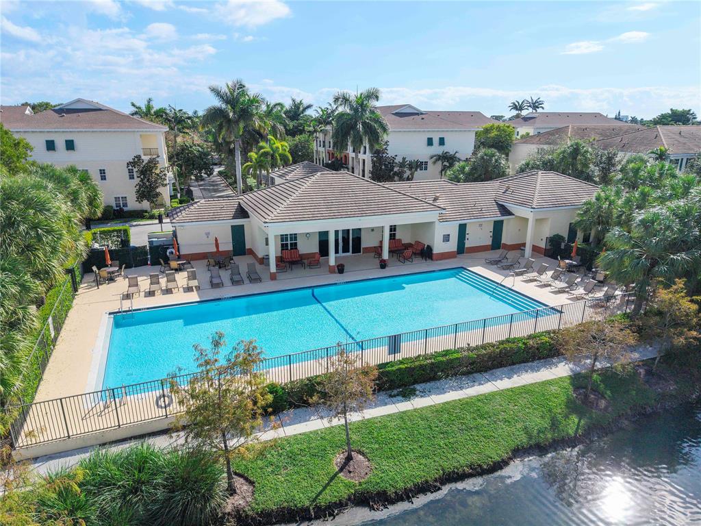 163 Southwest 7th Street Pompano Beach, FL 33060 - Photo 40 of 54 a aerial view of a house with swimming pool and a yard