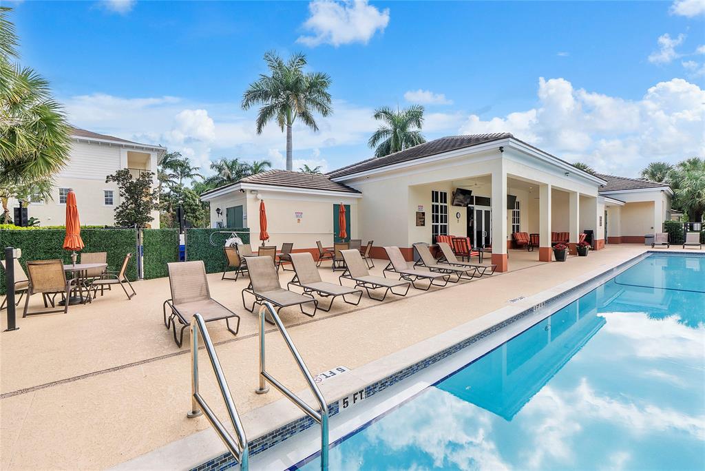 163 Southwest 7th Street Pompano Beach, FL 33060 - Photo 44 of 54 a view of a white house with a patio