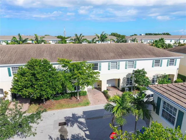 an aerial view of a house with a lake view