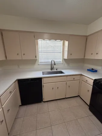 a kitchen with a cabinets and window