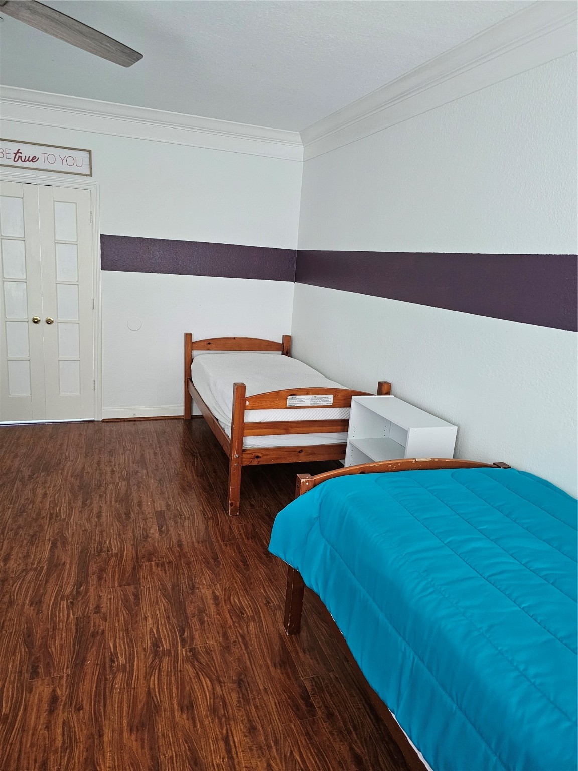 1211 Lark Lane Richmond, TX 77469 - Photo 13 of 24 a bedroom with a bed and a dresser