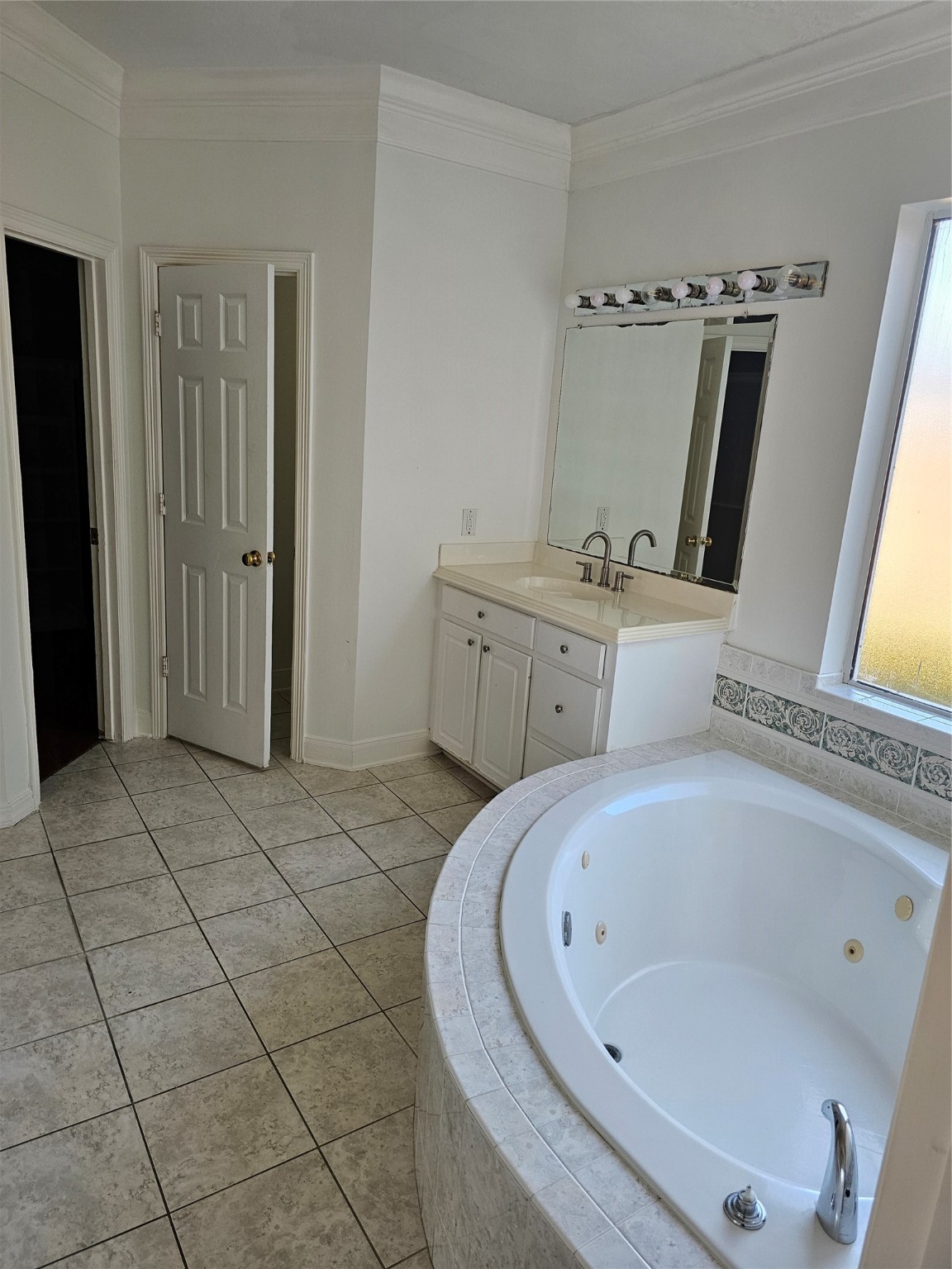 1211 Lark Lane Richmond, TX 77469 - Photo 14 of 24 a spacious bathroom with a tub sink and mirror