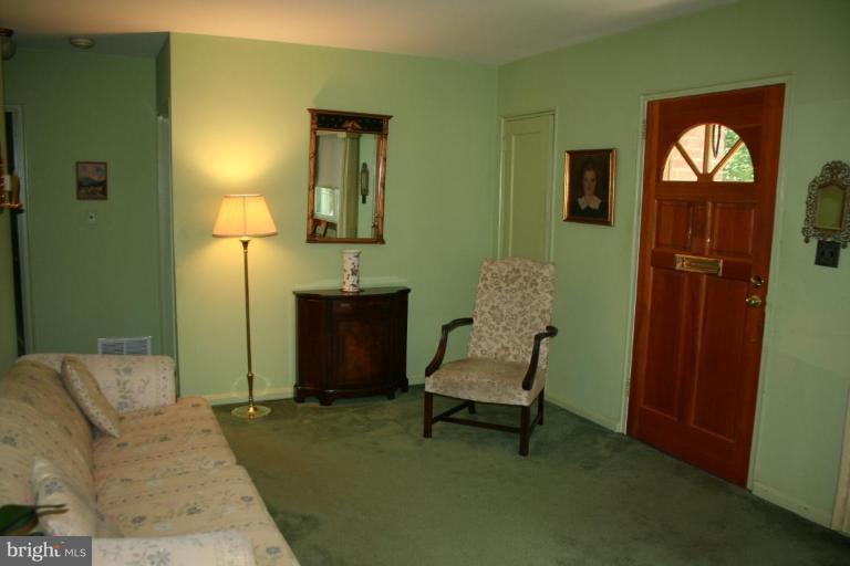 5903 Greentree Road Bethesda, MD 20817 - Photo 2 of 19 a living room with furniture and a window