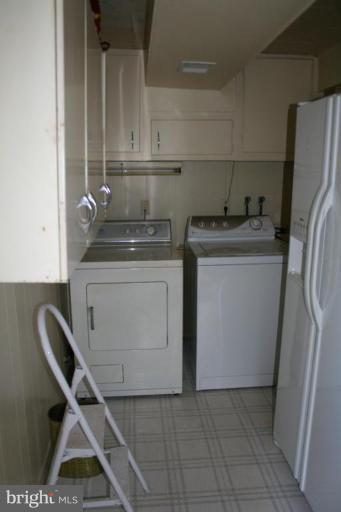 5903 Greentree Road Bethesda, MD 20817 - Photo 15 of 19 a utility room with dryer and washer